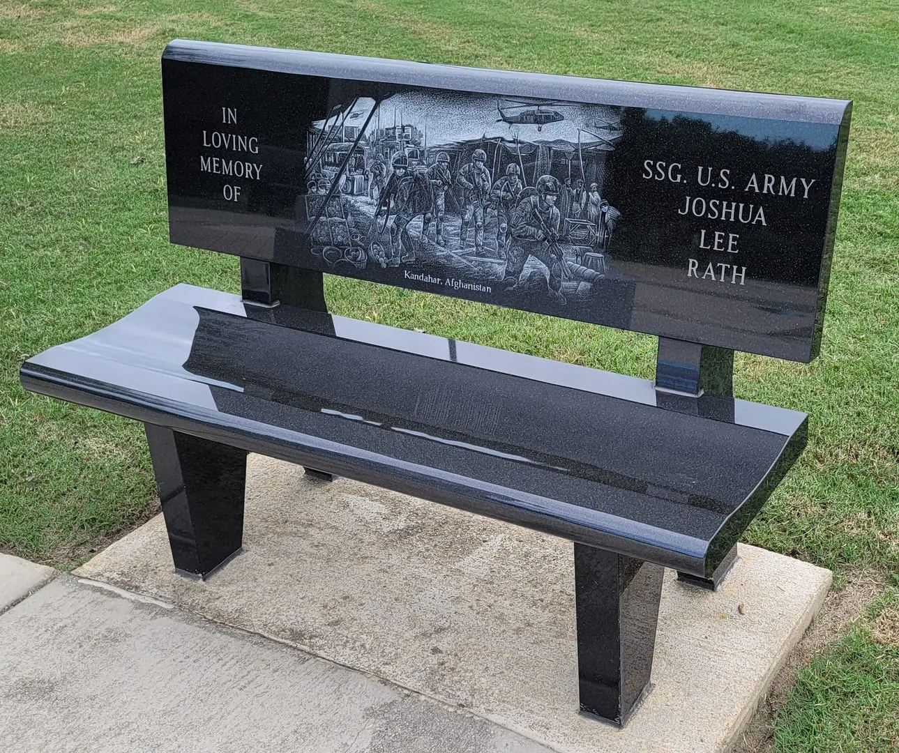 A picture of a beautiful bench in loving memory of Joshua Lee Rath