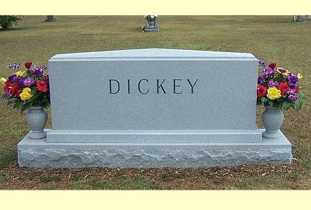 A memorial slab with the name and illustration by the text Dickey