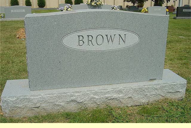 A memorial slab with the name and illustration by the text Brown