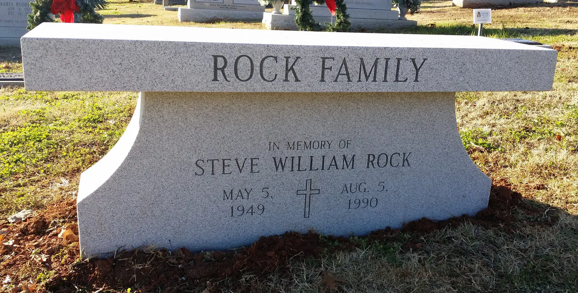 A memorial slab with the name Steve William Rock
