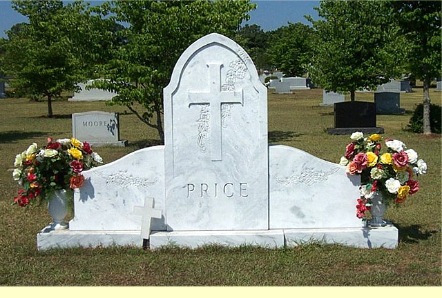 A memorial slab with the name Price and a cross sign