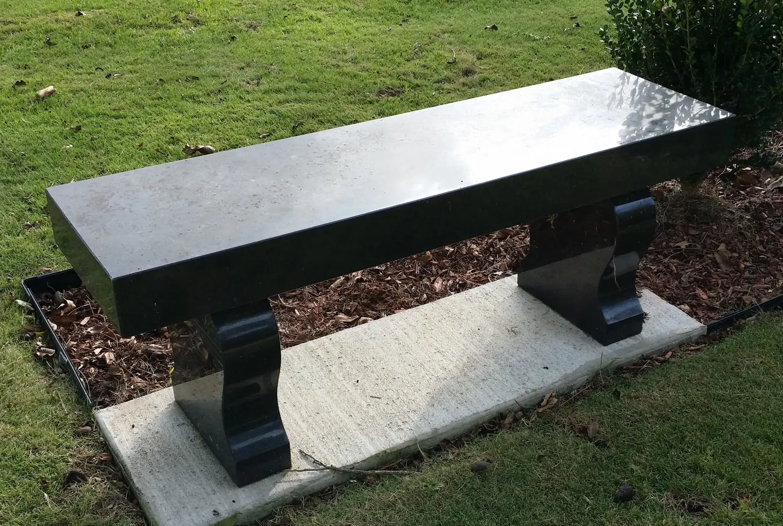 A beautiful crafted bench made out of black marble