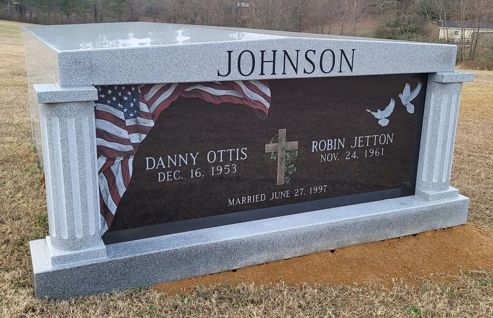 A memorial slab with the name Danny Ottis and Robin Jetton
