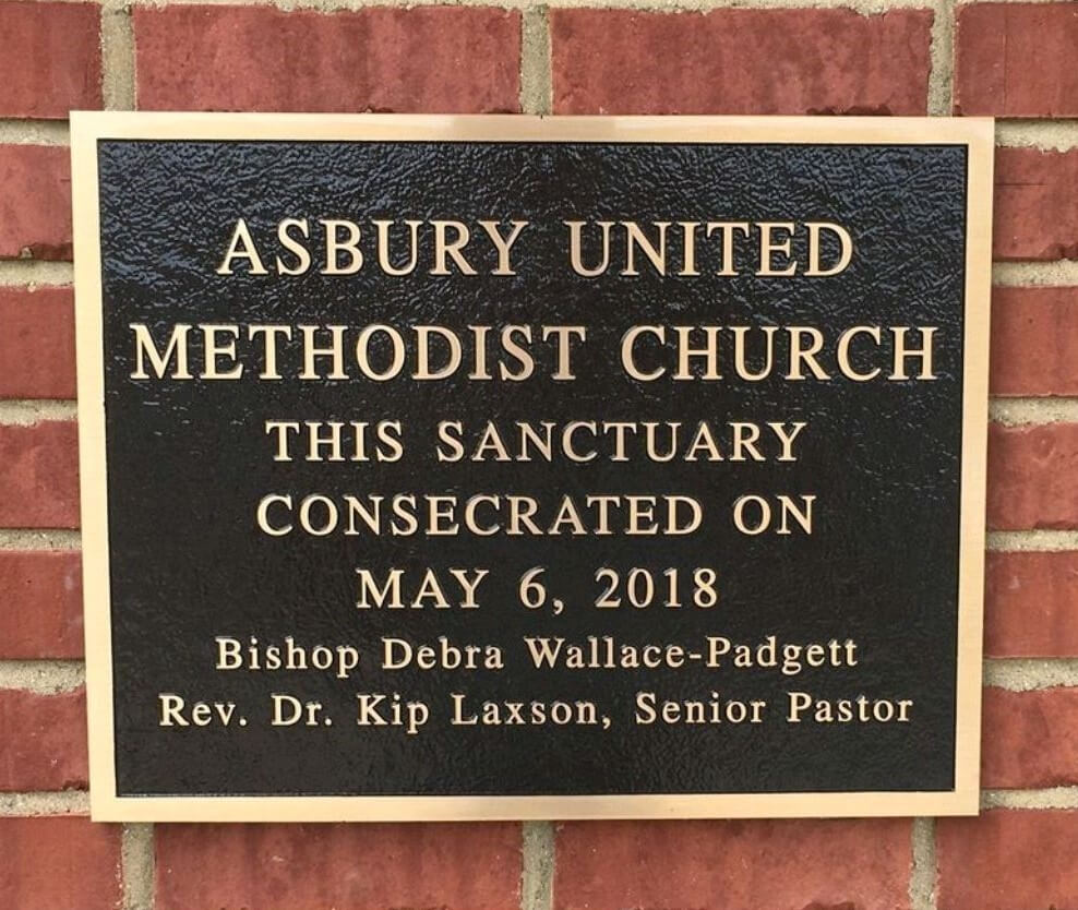 A memorial slab with the name Asbury United Methodist Church