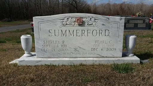 A memorial slab for Shirley P. and Pearl C.