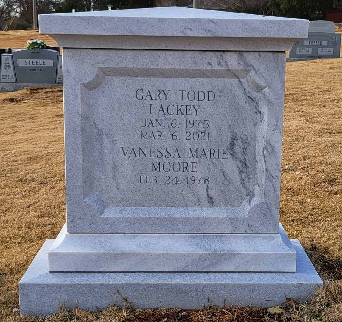 A memorial slab for Gary Todd Lackey and Vanessa Marie Moore