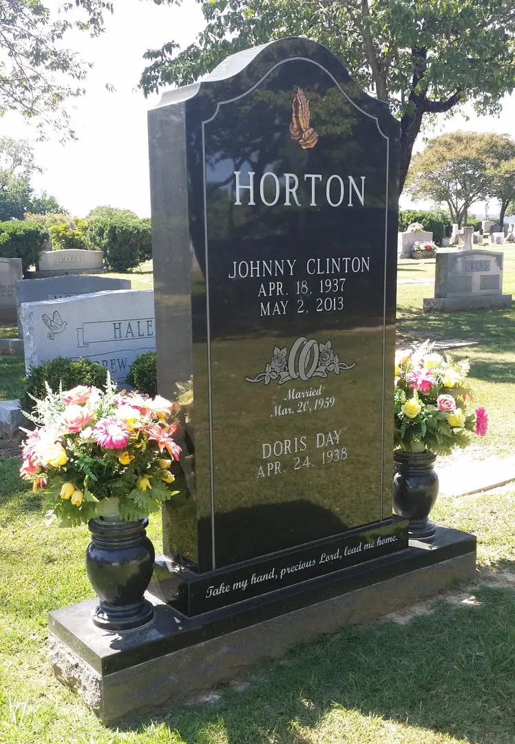 A memorial slab for Johnny Clinton at the graveyard