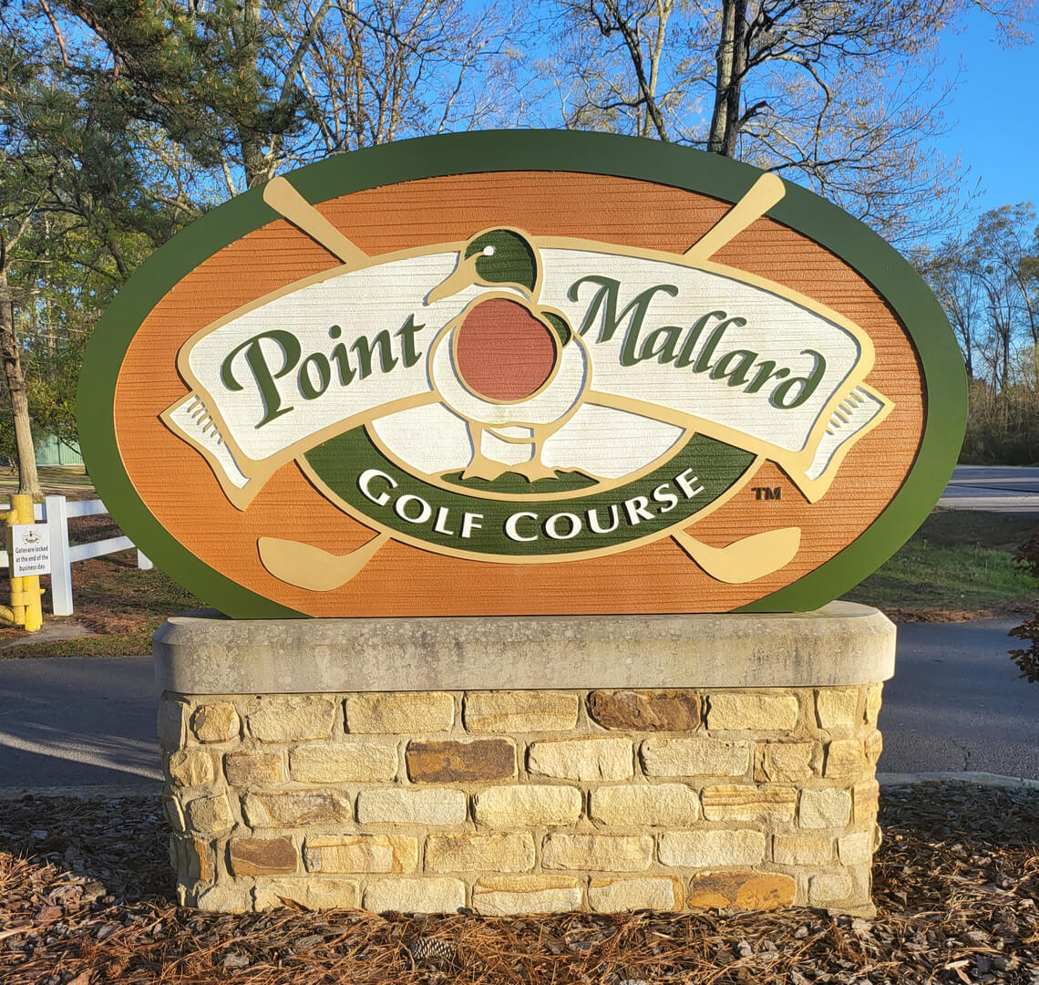 A sign board of Point Mallard Golf course