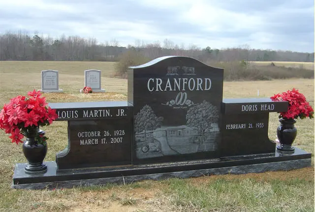 A memorial slab with the name Louis Martin Jr. and Doris Head