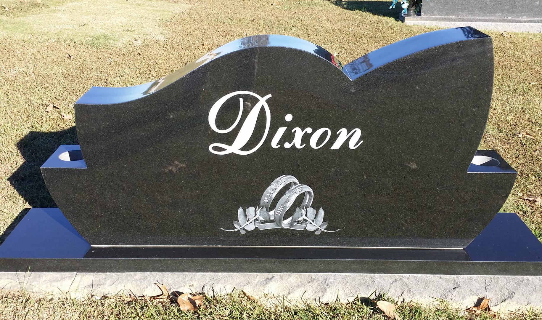 A memorial slab for with the logo and illustration of Dixon