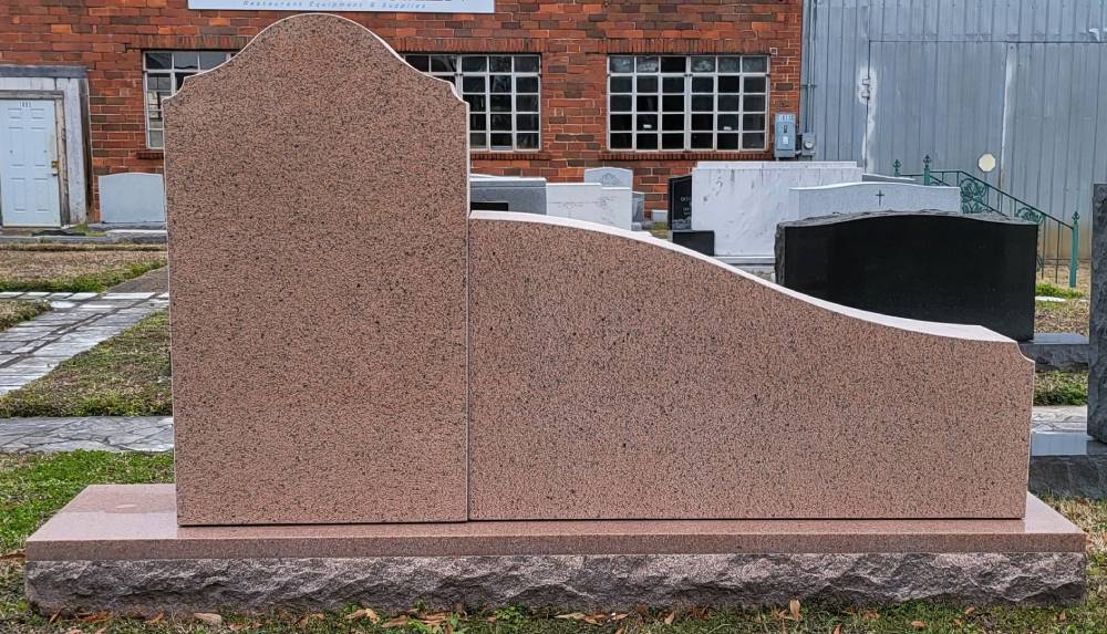 A unique design of memorial slab made out of red stone