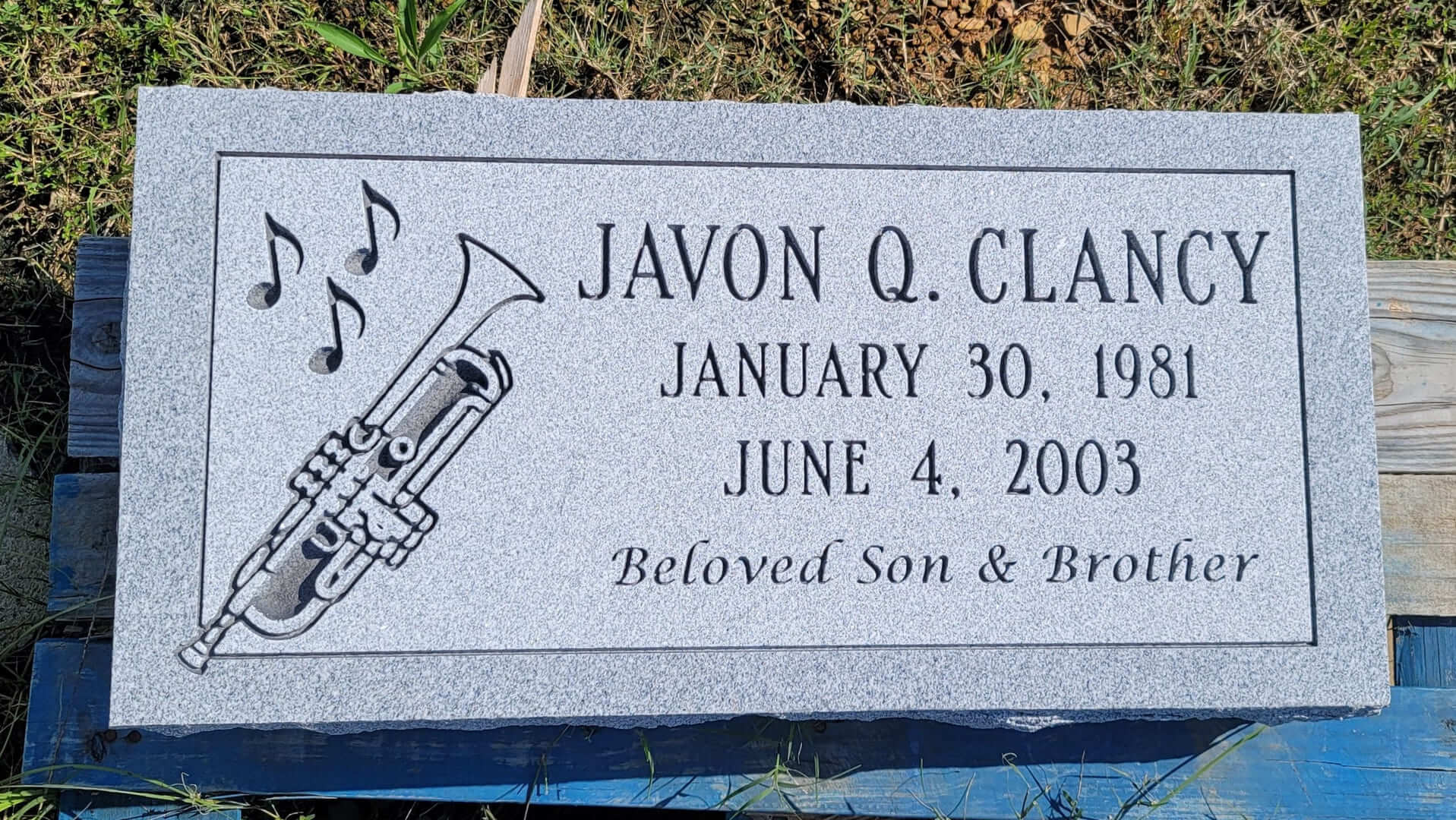 Javon Q Clancy Memorial Slab WIth Trumpet Design