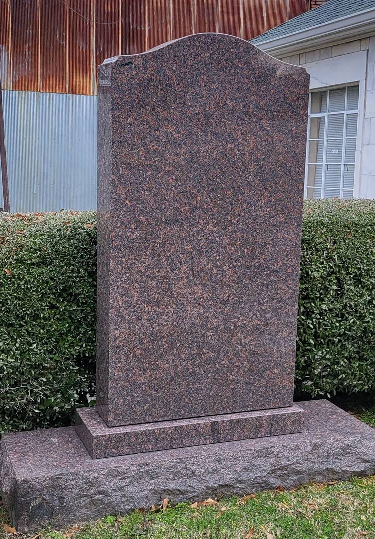 An empty tombstone made out of hard granite