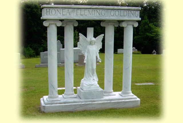 A unique shaped mausoleum with the name Honea Fleming Golding