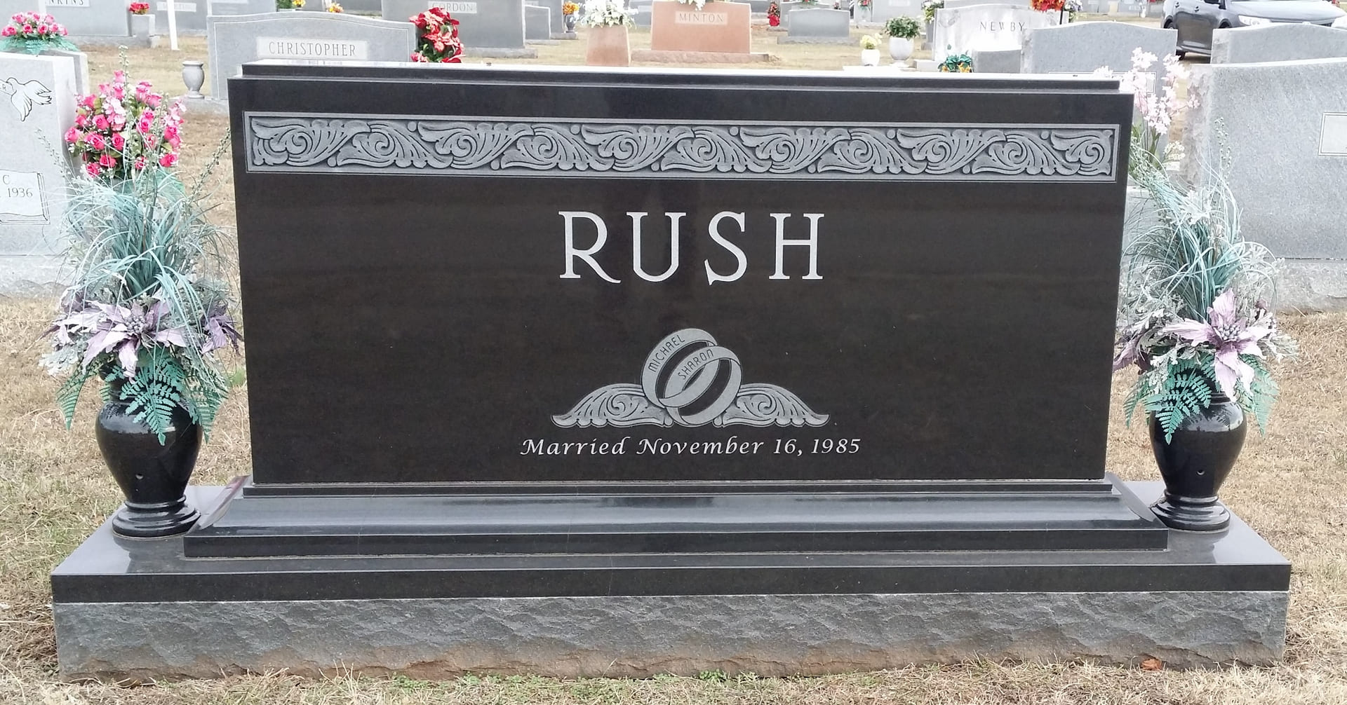 A memorial slab for with logo and illustration of RUSH