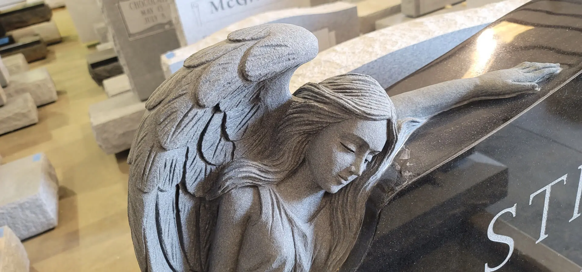 A beautiful statue of an angel with sings sleeping