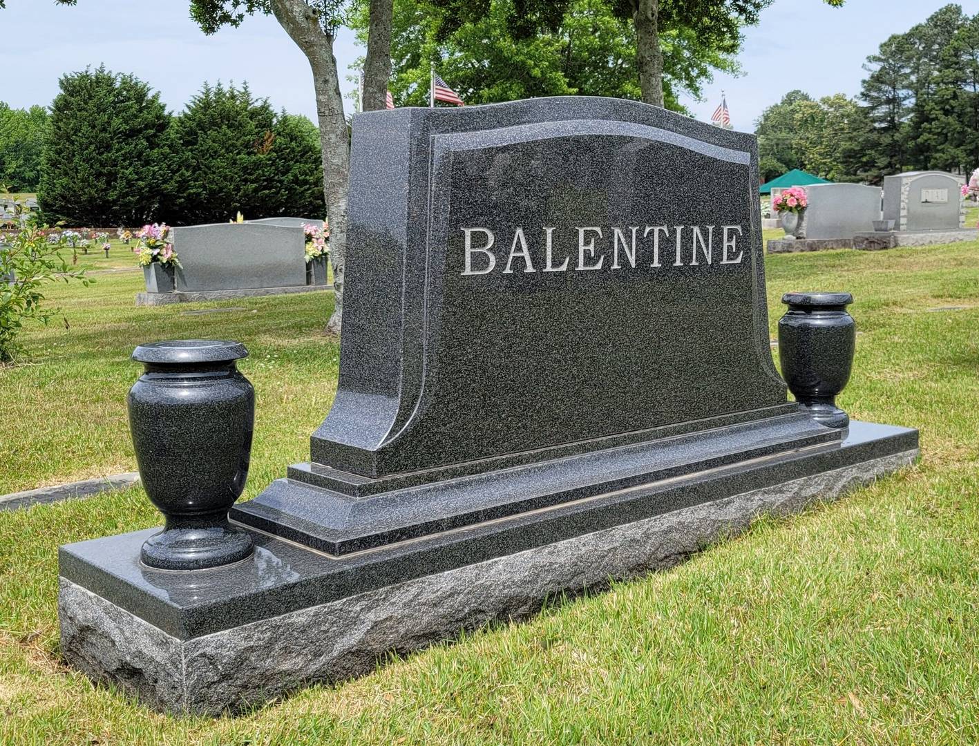 A memorial slab and tombstone with the name of Balentine