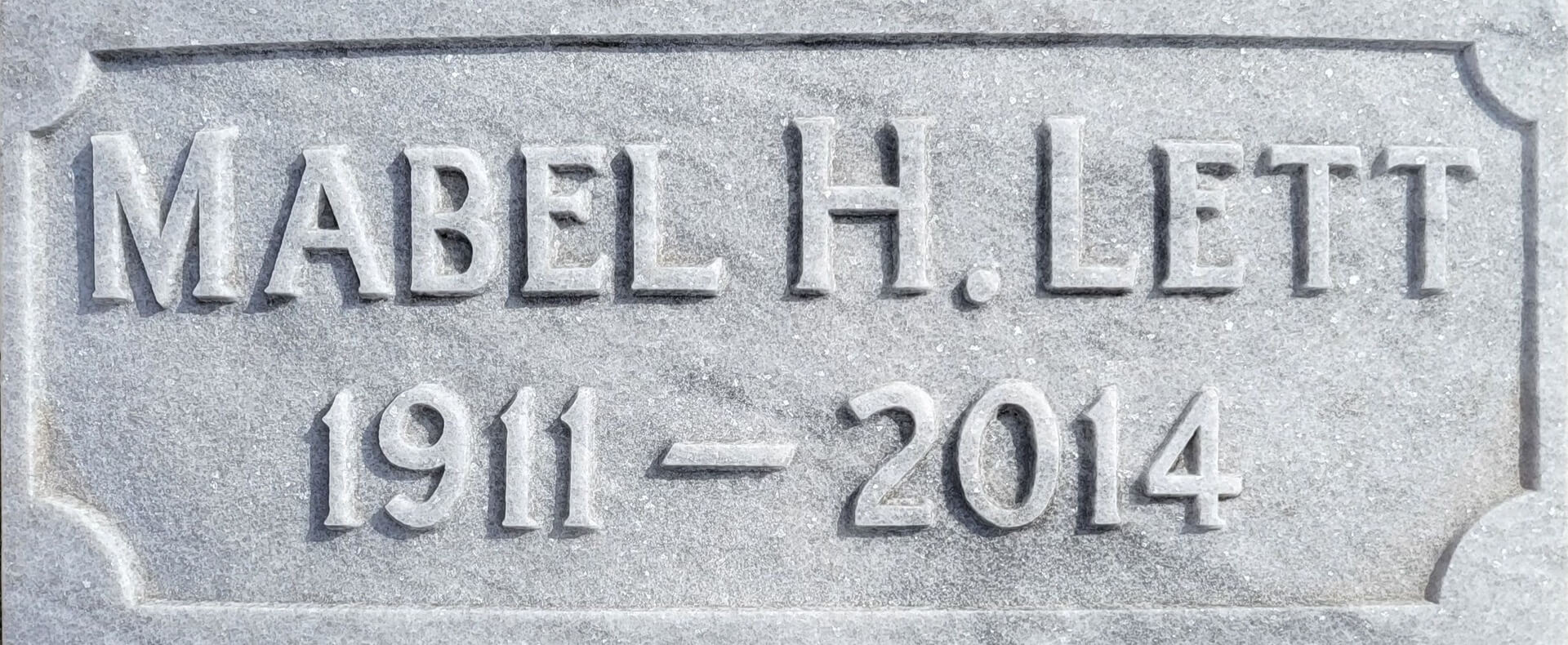 A memorial slab with the name Mabel H. Lett