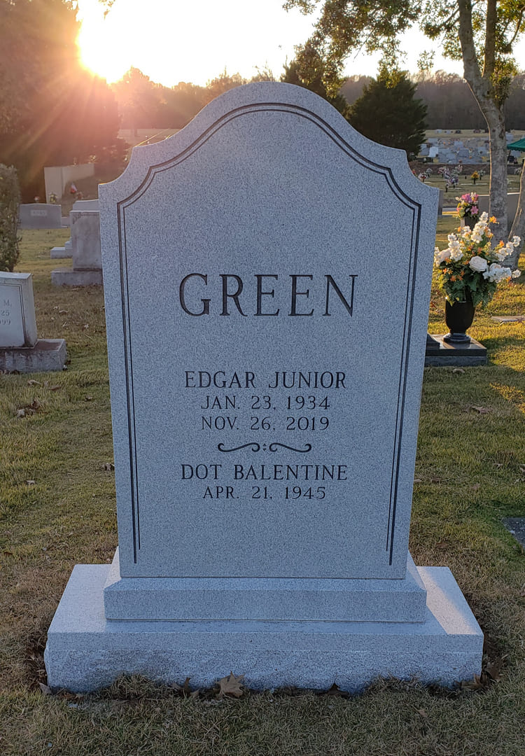 A memorial slab for Edgar Junior at the graveyard