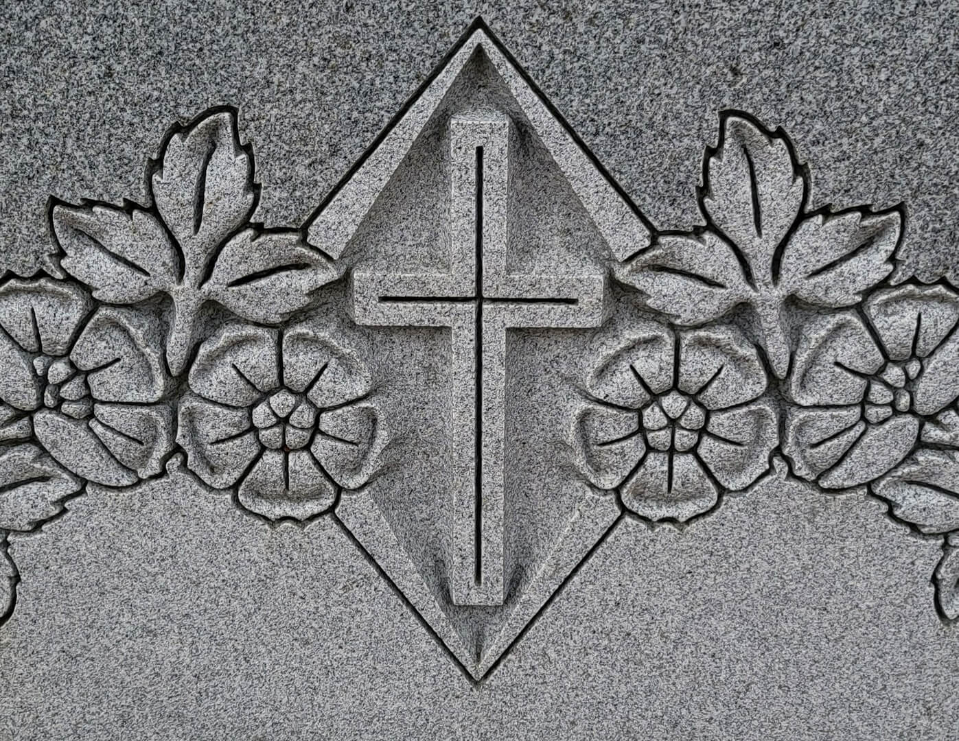 A beautiful piece of artwork of a cross and flowers