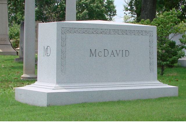 A memorial slab with the name and illustration of Mcdavid