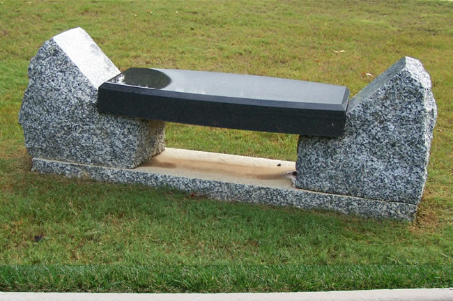 A beautiful black marble bench at the graveyard