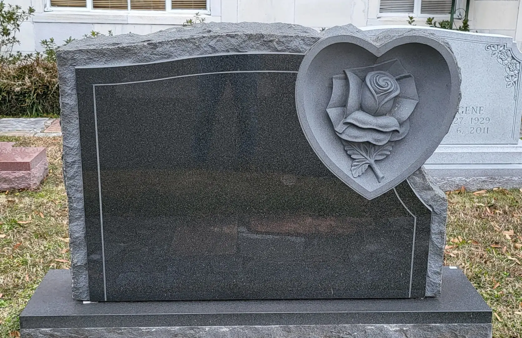 A beautiful memorial slab with a rose illustration