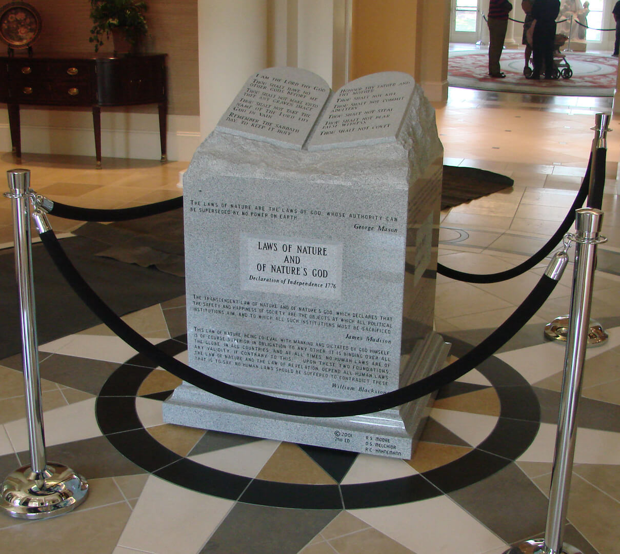 A memorial slab with the quote from the bible and historical figures