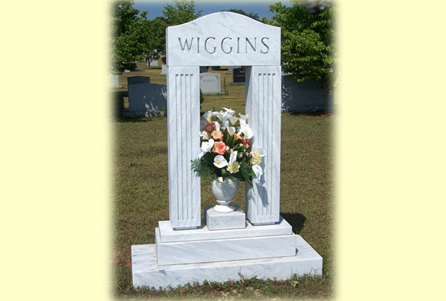 A unique shaped mausoleum with the name Wiggins