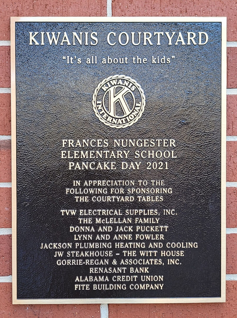 A memorial slab with the name Kiwanis Courtyard