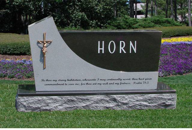 A memorial slab with the illustration and text of Horn