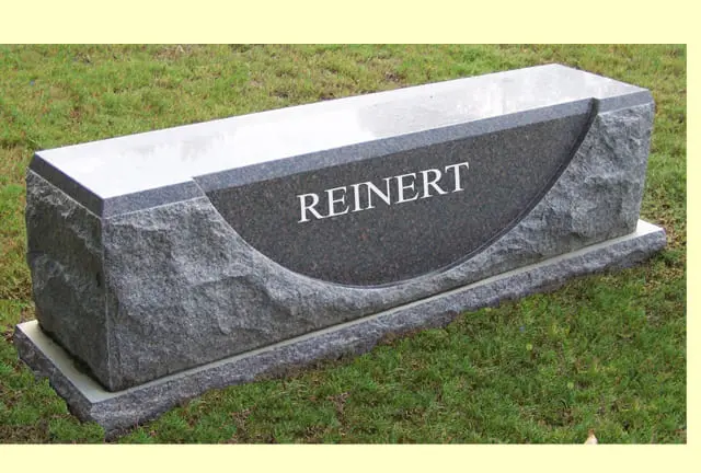 A memorial slab with the name and illustration of Reinert