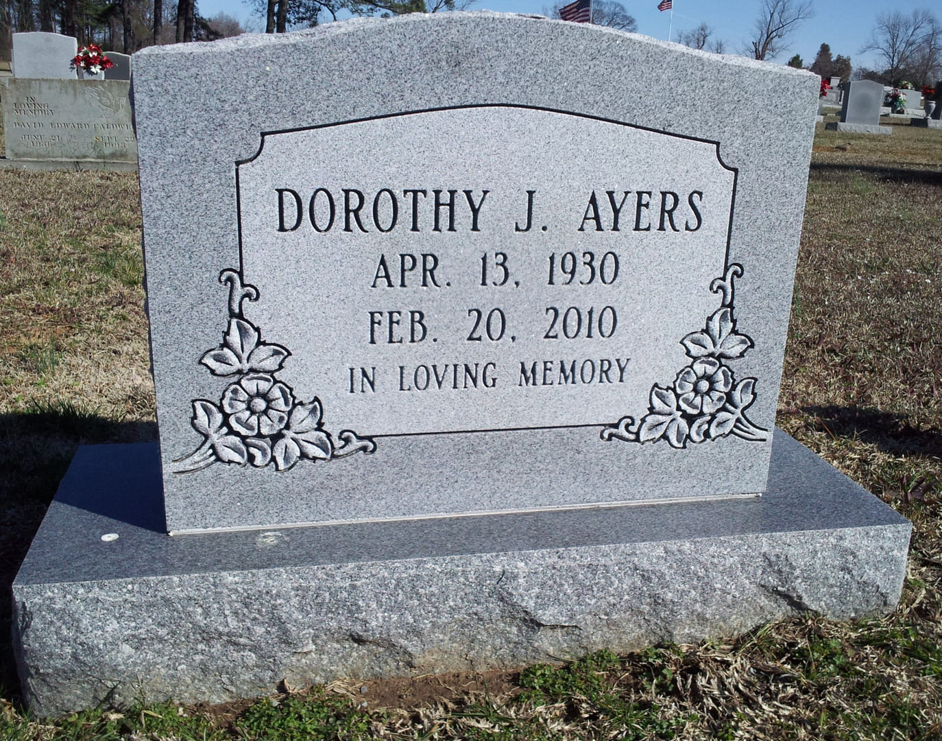 A memorial slab for Dorothy J. Ayers at the graveyard