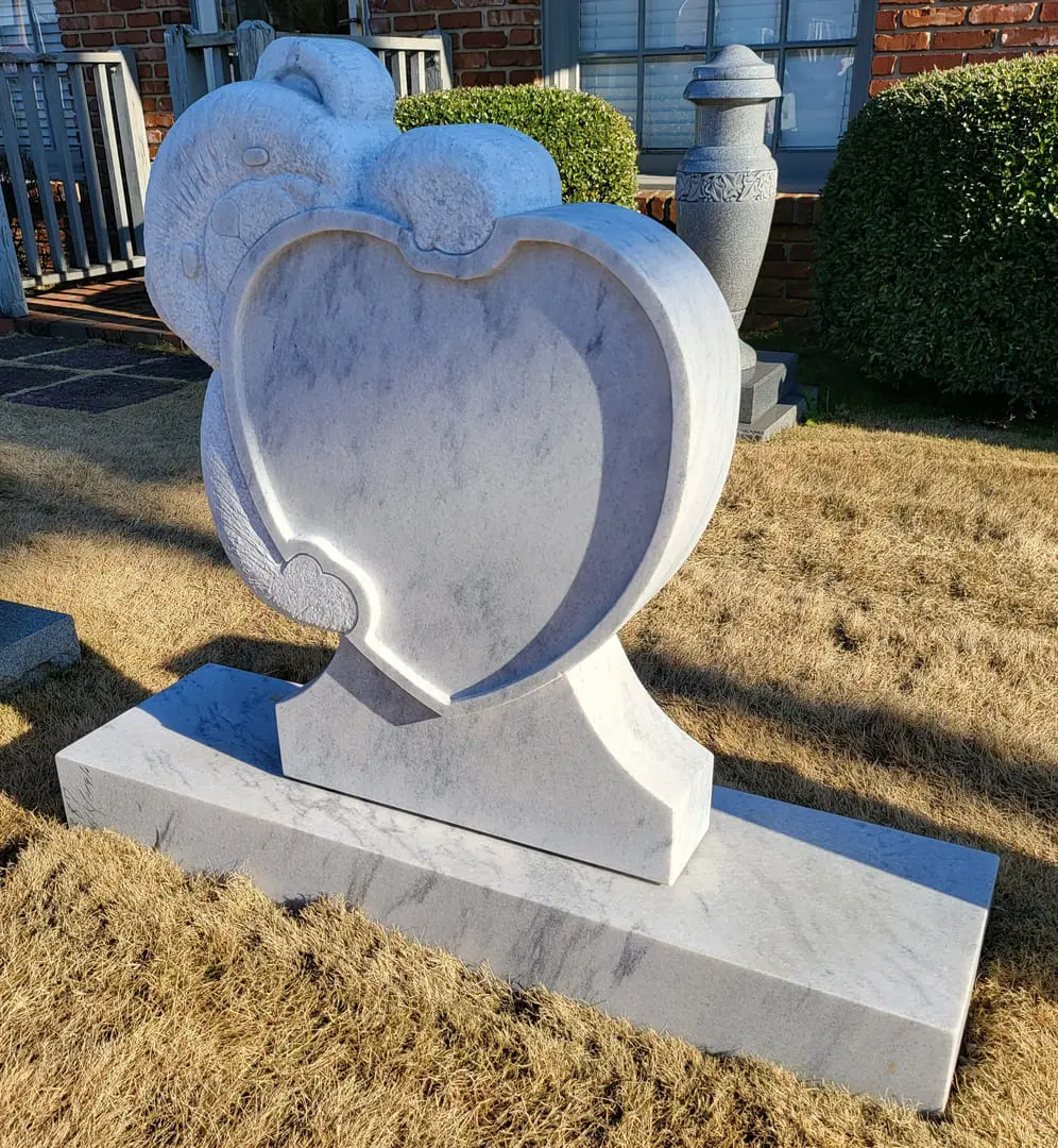 A memorial slab with a heart-shaped design
