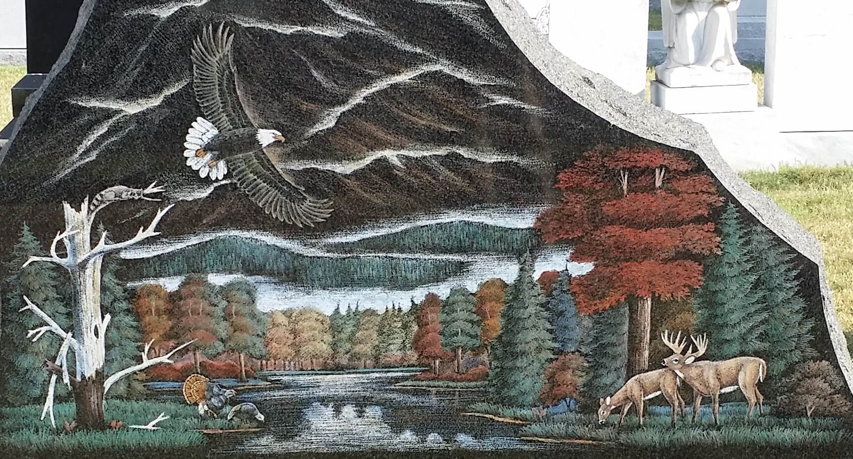 A beautiful piece of artwork with eagle and deers