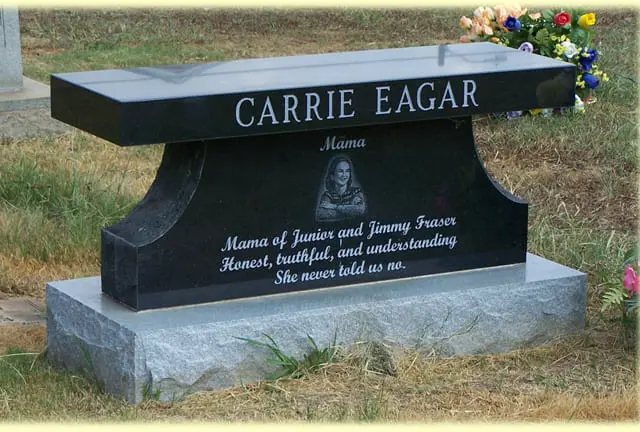 A memorial slab with the name and illustration of Carrie Eagar
