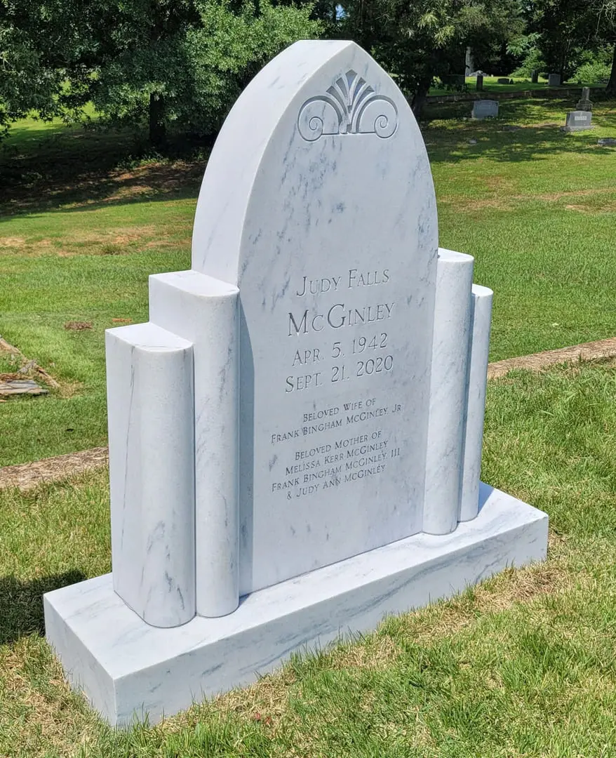 A memorial slab for Judy Falls Mcginley at the graveyard