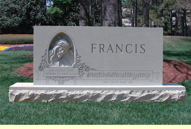 A memorial slab with the name Francis and a Jesus illustration