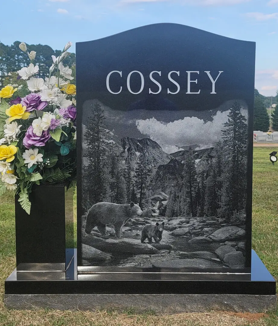 A unique shaped mausoleum with the name Cossey