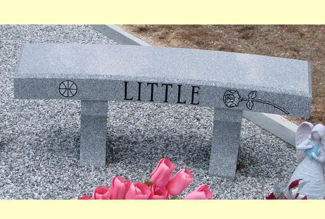 A picture of a beautiful bench with the name Little on it