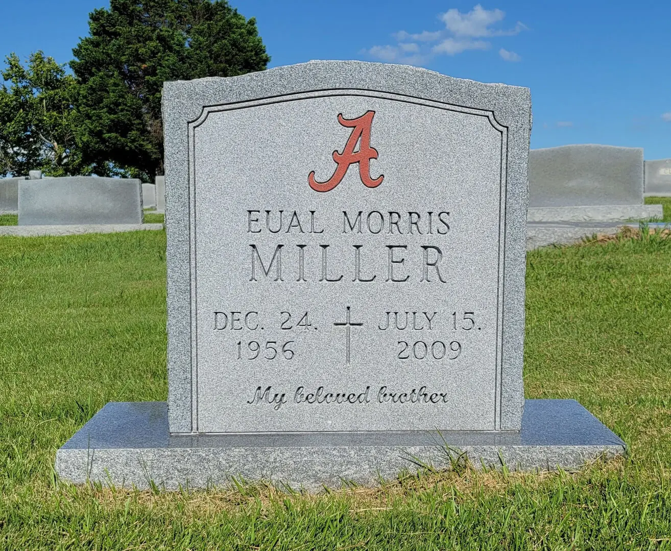 A memorial slab for Eual Morris Miller at the graveyard