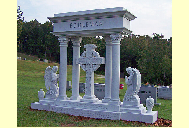 A cross shaped memorial slab with the name Eddleman