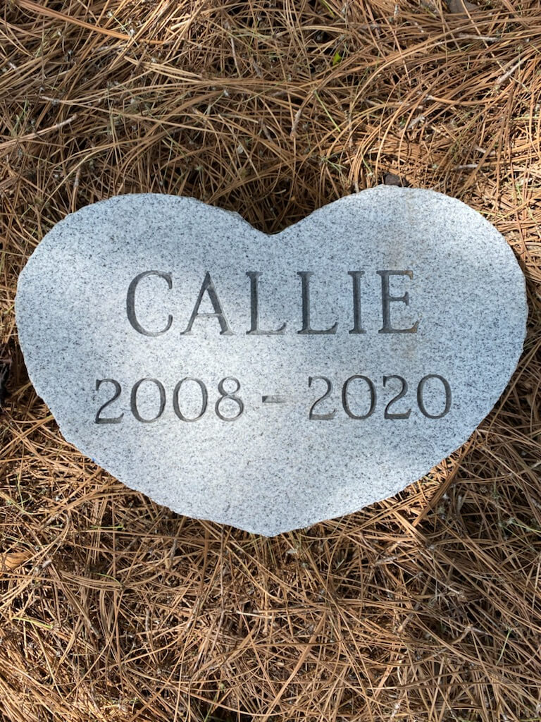 A memorial slab with the name Callie