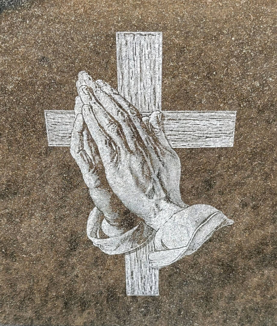 A beautiful piece of artwork with a hand and a cross