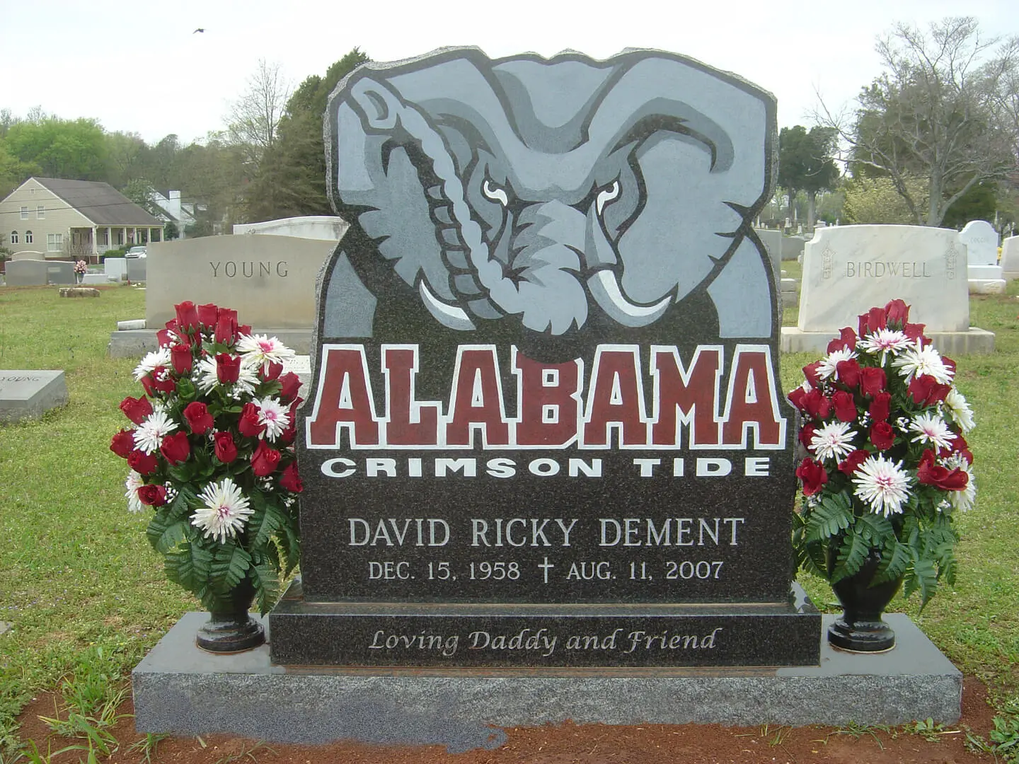 A memorial slab with the name David Ricky Dement