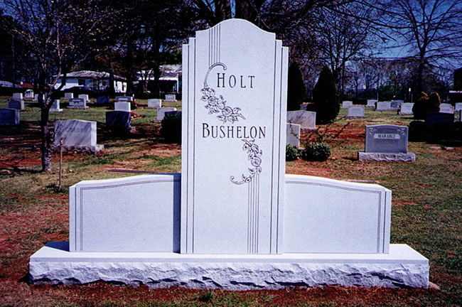 A memorial slab with the name Holt and Bushelon
